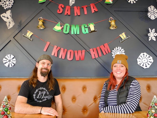 Better Together Café owners Zach Kinzer (left) and Becky Kinzer have transformed their business with an "Elf"-themed pop-up for December. Becky Kinzer said the goal was to make the café "look like Gimbels" from the movie.