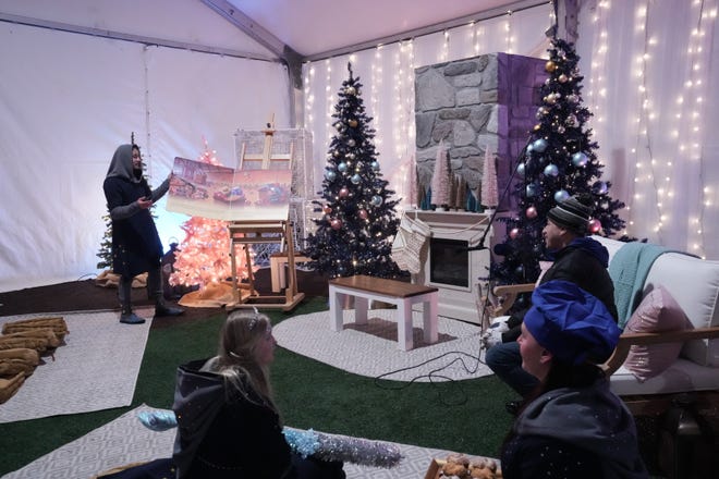At Enchant Christmas in Franklin, families can take a break from the outdoor light maze to listen to stories, color and play.
