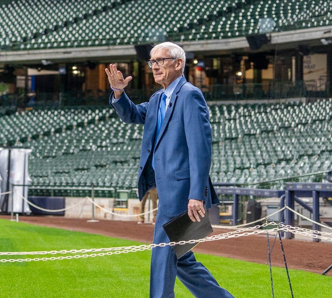Gov. Tony Evers arrives at American Family Field as he prepares to sign Assembly Bill 438 and Assembly Bill 439, a bipartisan package of bills passed by the Wisconsin State Legislature to keep the Milwaukee Brewers and Major League Baseball (MLB) in Wisconsin through 2050, on Tuesday December 5, 2023 in Milwaukee, Wis.