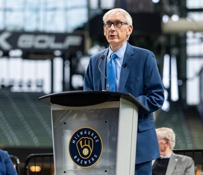Gov. Tony Evers makes remarks as he prepares to sign Assembly Bill 438 and Assembly Bill 439, a bipartisan package of bills passed by the Wisconsin State Legislature to keep the Milwaukee Brewers and Major League Baseball (MLB) in Wisconsin through 2050, on Tuesday December 5, 2023 at American Family Field in Milwaukee, Wis.