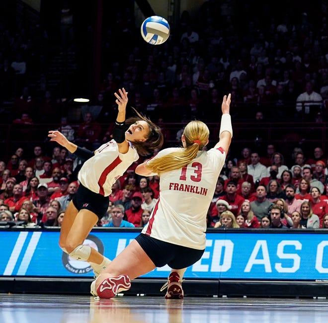 Wisconsin setter Izzy Ashburn (11) and outside hitter Sarah Franklin (13) attempt to save the ball during the fourth set of the NCAA Regional Volleyball semifinal match against Penn State on Thursday December 7, 2023 at the UW Field House in Madison, Wis.