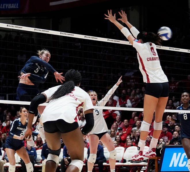 Wisconsin middle blocker Caroline Crawford (9) misses blocking the hit from Penn State outside hitter Jess Mruzik (9) during the fourth set of the NCAA Regional Volleyball semifinal match on Thursday December 7, 2023 at the UW Field House in Madison, Wis.