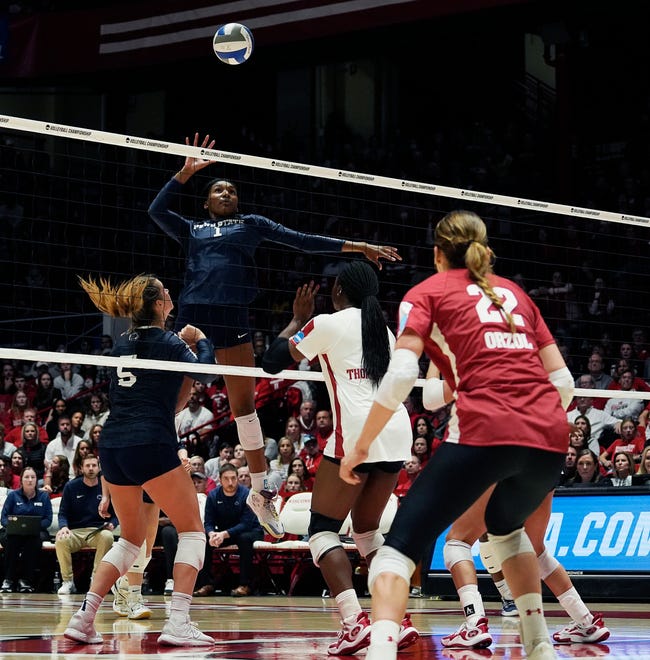 Penn St. middle blocker Taylor Trammell (1) goes for a spike during the fourth set of the NCAA Regional Volleyball semifinal match against Wisconsin on Thursday December 7, 2023 at the UW Field House in Madison, Wis.
