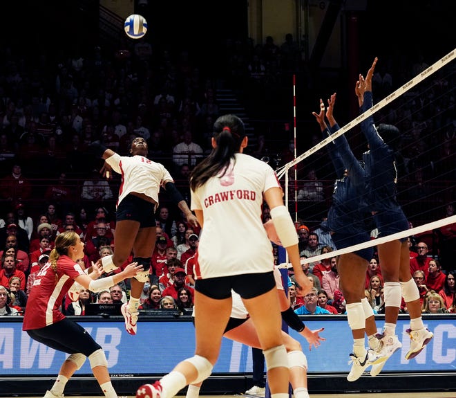 Wisconsin outside hitter Temi Thomas-Ailara (12) goes for a spike during the third set of the NCAA Regional Volleyball semifinal match against Penn State on Thursday December 7, 2023 at the UW Field House in Madison, Wis.