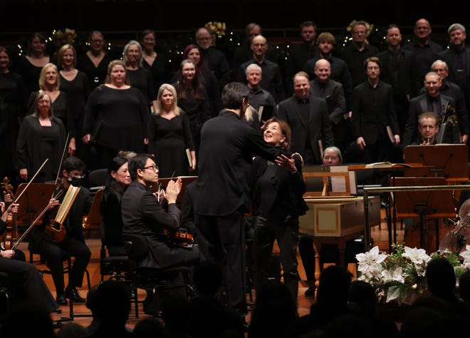 Milwaukee Symphony Orchestra music director Ken-David Masur embraces chorus director Cheryl Frazes Hill following the Dec. 8 performance of Handel's "Messiah."