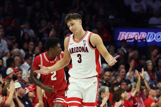 Arizona guard Pelle Larsson celebrates Saturday after a making a three-point basket against Wisconsin. He led the Wildcats with 21 points.