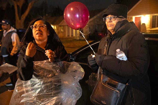 Seneca McDade (left) and her mother Debra McDade attend the 1-year remembrance vigil on Dec. 9, 2023 honoring the life of Aundre Cross, a 44-year-old U.S. Postal Service worker who was shot and killed while delivering mail a year ago on Dec. 9, 2022 in the 5000 block of North 65th Street in Milwaukee.