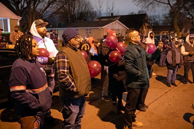 Community members gather to remember the life of Aundre Cross, a 44-year-old U.S. Postal Service worker who was shot and killed while delivering mail a year ago on Dec. 9, 2022 in the 5000 block of North 65th Street in Milwaukee.
