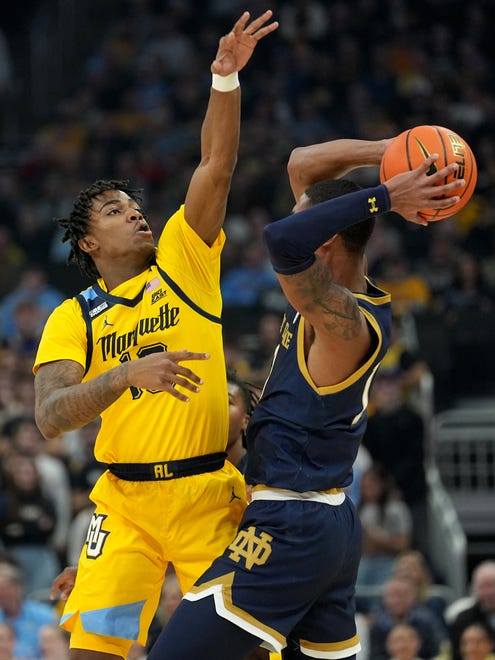 Marquette's Zaide Lowery (10) guards Notre Dame forward Tae Davis (13) during the first half of their game Saturday, December 9, 2023 at Fiserv Forum in Milwaukee, Wisconsin.
