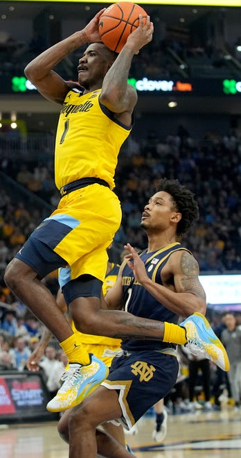 Marquette guard Kam Jones (1) goes to the basket during the first half of their game against Notre Dame Saturday, December 9, 2023 at Fiserv Forum in Milwaukee, Wisconsin.