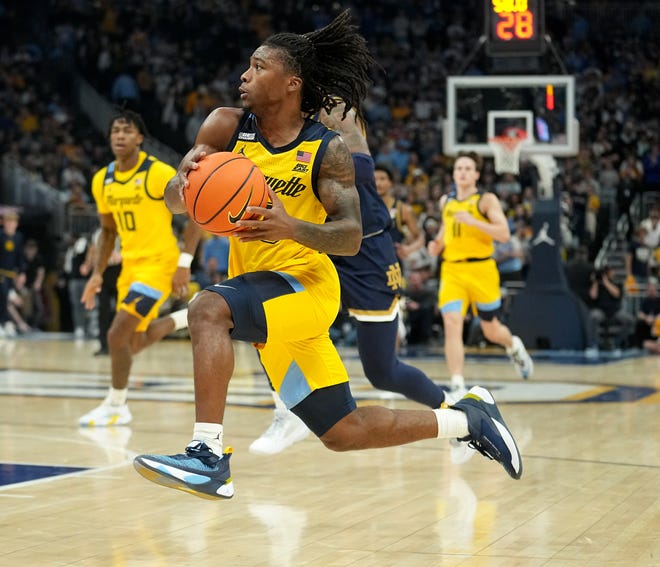 Marquette guard Sean Jones (22) drives to the basket during the first half of their game against Notre Dame Saturday, December 9, 2023 at Fiserv Forum in Milwaukee, Wisconsin.