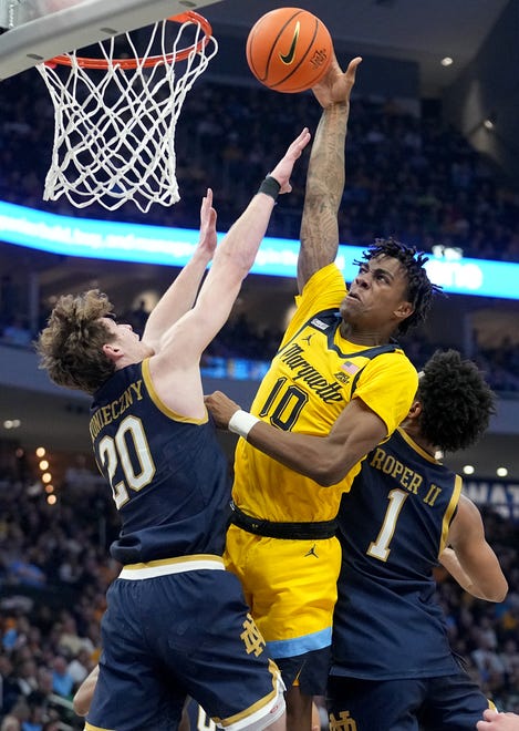 Marquette guard Zaide Lowery (10) misses a shot while being double-teamed by Notre Dame guard J.R. Konieczny (20) and guard Julian Roper II (1) during the first half of their game Saturday, December 9, 2023 at Fiserv Forum in Milwaukee, Wisconsin.