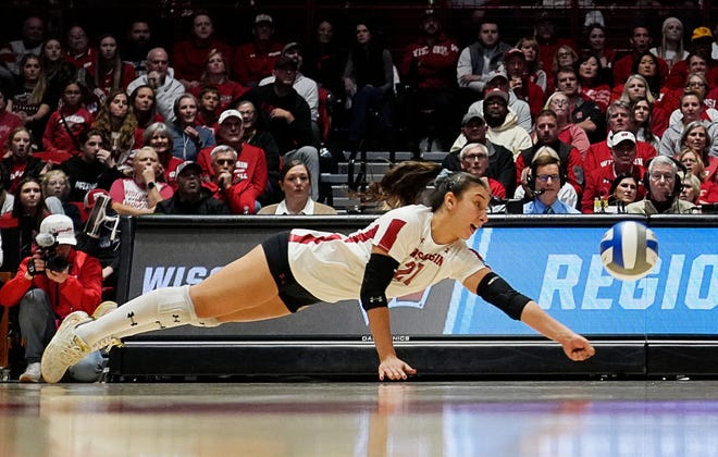 Wisconsin libero/defensive specialist Gulce Guctekin (21) dives for the ball during the first set of the NCAA Regional Volleyball Finals match against Oregon on Saturday December 9, 2023 at the UW Field House in Madison, Wis.