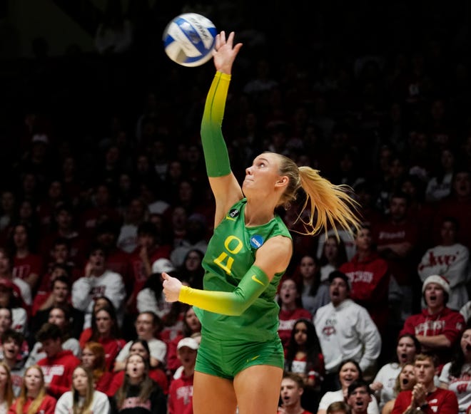 Oregon outside hitter Daley McClellan (4) serves the ball during the first set of the NCAA Regional Volleyball Finals match against Wisconsin on Saturday December 9, 2023 at the UW Field House in Madison, Wis.