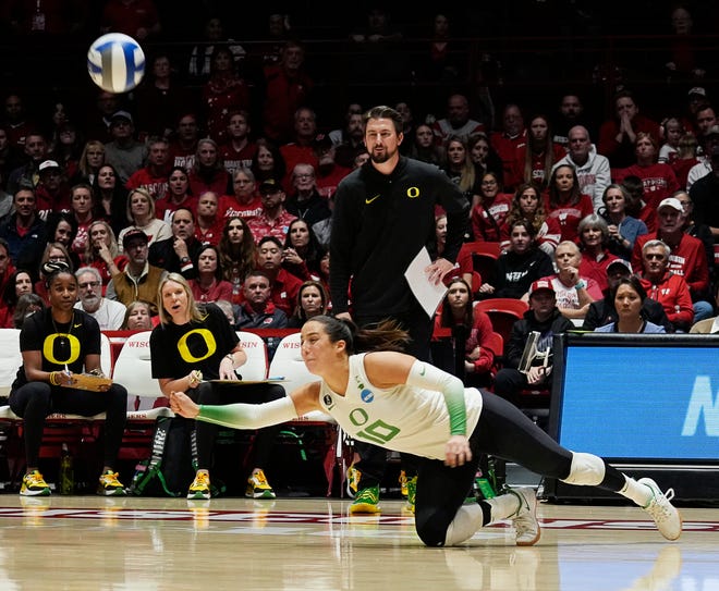 Oregon libero Georgia Murphy (10) dives for the ball during the second set of the NCAA Regional Volleyball Finals match against Wisconsin on Saturday December 9, 2023 at the UW Field House in Madison, Wis.