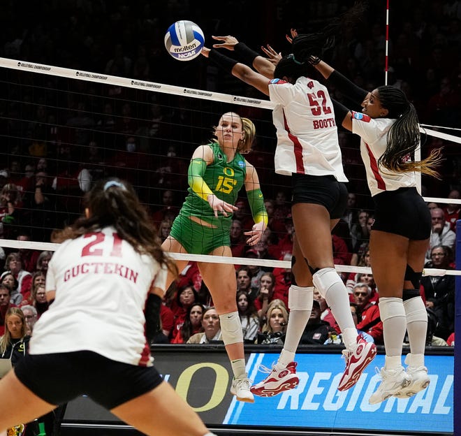 Wisconsin libero/defensive specialist Gulce Guctekin (21) prepares to hit the spike from Oregon outside hitter Mimi Colyer (15) during the fourth set of the NCAA Regional Volleyball Finals match on Saturday December 9, 2023 at the UW Field House in Madison, Wis.